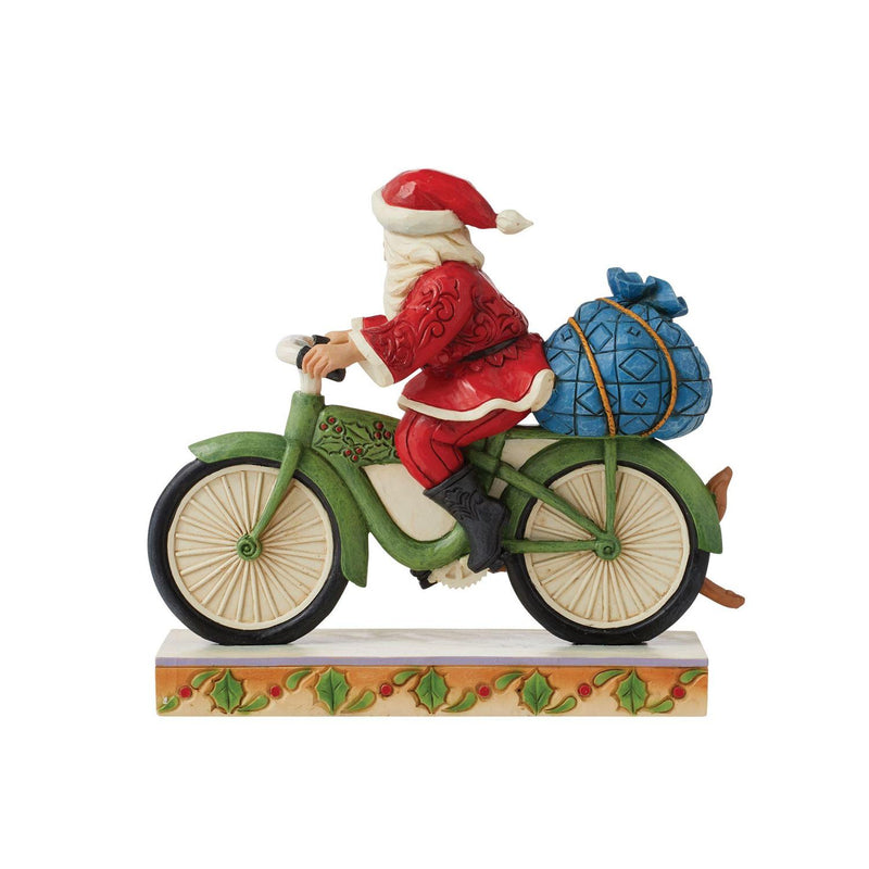 Santa Riding a Bicycle Figurine