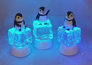 Penguin Sitting on Color-changing Lighted Icecube -