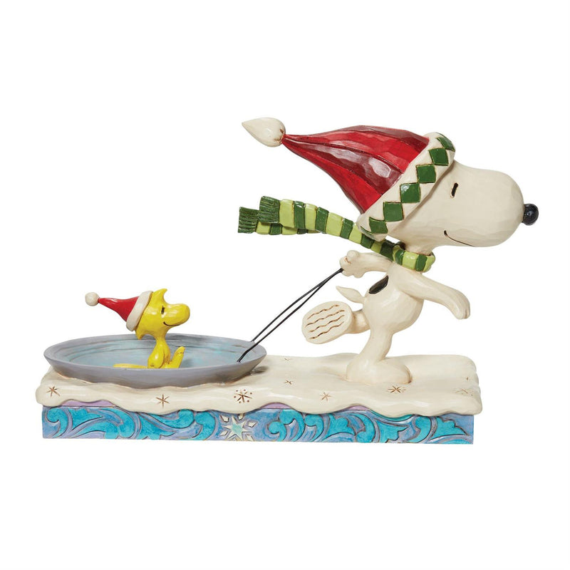 Snoopy Pulling Woodstock on a Sled