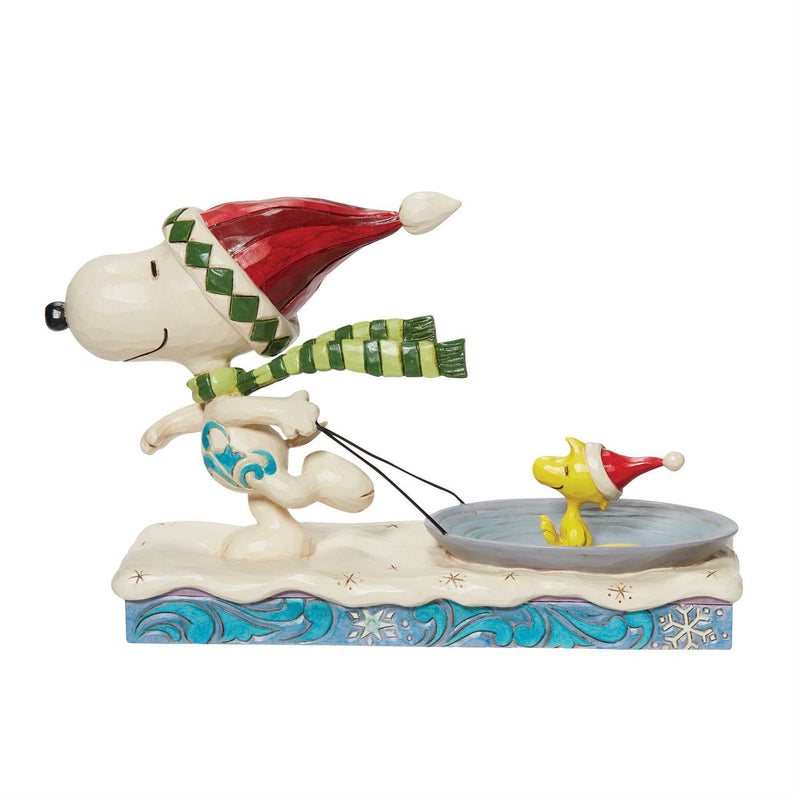 Snoopy Pulling Woodstock on a Sled